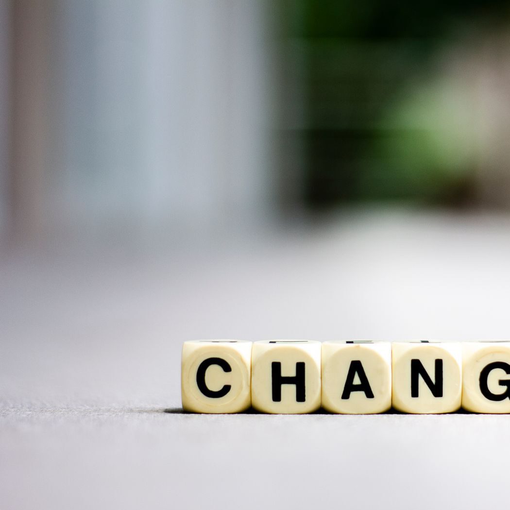 Close-up of letter blocks spelling 'CHANGE', symbolizing transformation and growth.